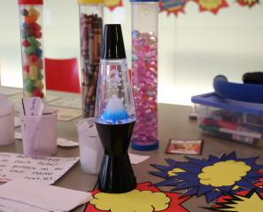 A lava lamp on a table. 