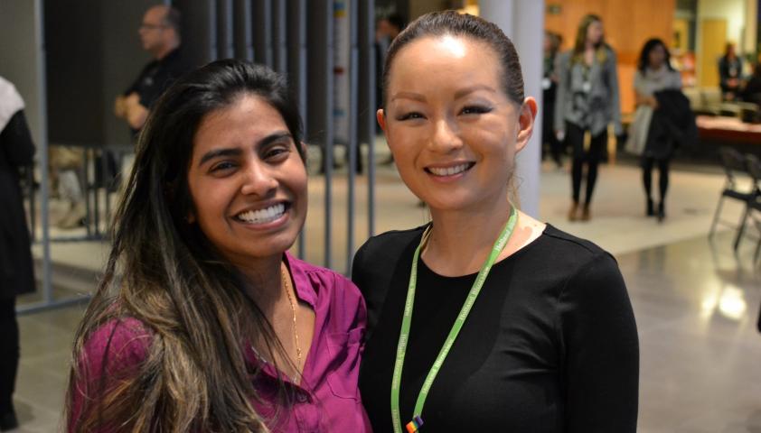 Jeannie Fong, research operations assistant, and Shalini Rajeshwaran, human resources and trainee coordinator, looking relaxed after a successful morning of  presentations.