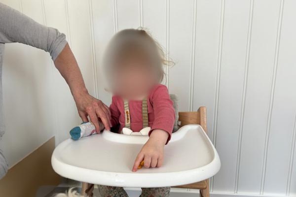 Finger feeding - Place small pieces of food on the food tray and infant to use their thumb and pointer (without middle finger) to self-feed.