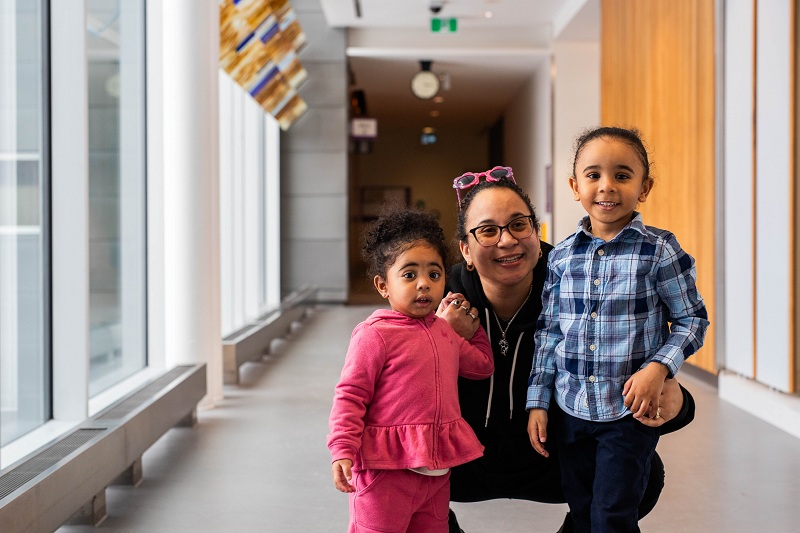 Alifa Khan, a parent and Family as Faculty educator, poses with her children.