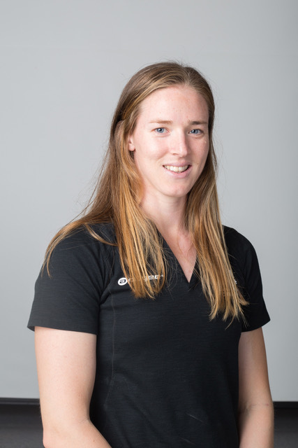 Caucasian female with light brown hair in a black t-shirt