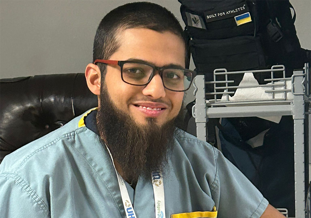 Close-up of Shaad in an office, smiling
