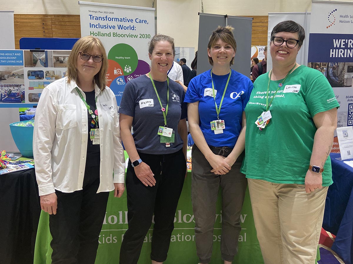Larissa (right) with teammates (from left): Heidi Schwellnus, collaborative practice leader, Alysha Friedman, occupational therapist and Kerri Kelland, physiotherapist, at a job fair hosted by the University of Toronto.