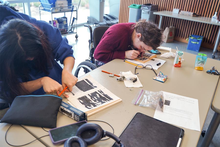 Two teenagers are working on writing a book