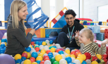 Client playing in the therapeutic recreation room