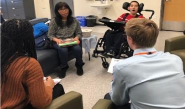 group of healthcare students and client