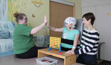 Client and staff high-fiving