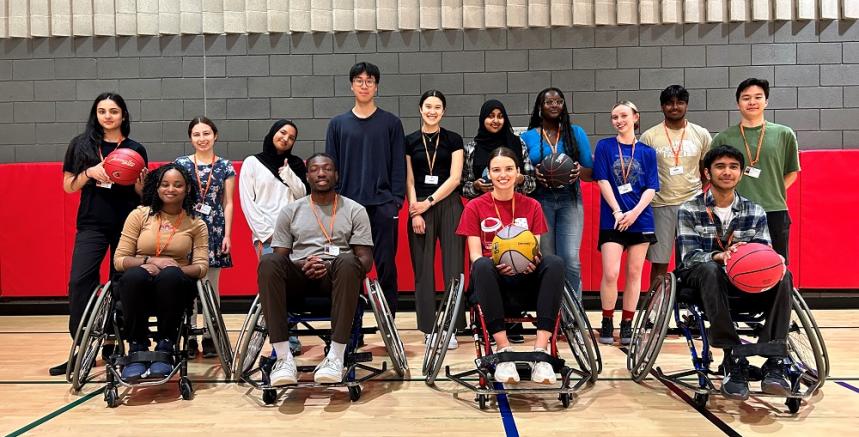 A group of people in a basketball court