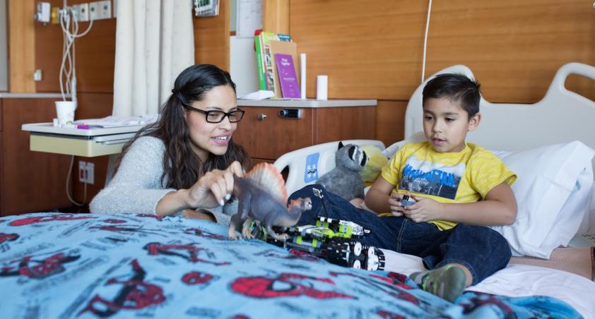 Parent with child in sleeper bed