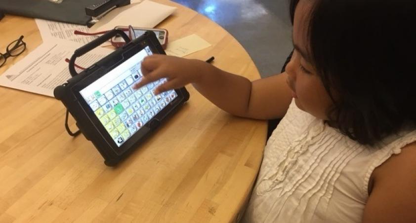 Girl using Assistive Technology device