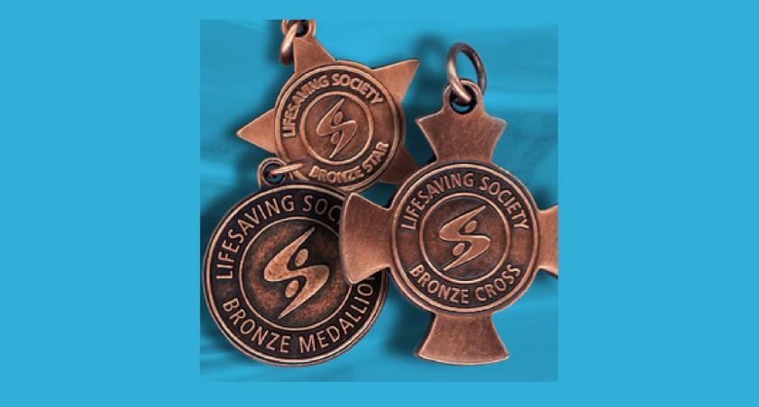 bronze cross medals on blue