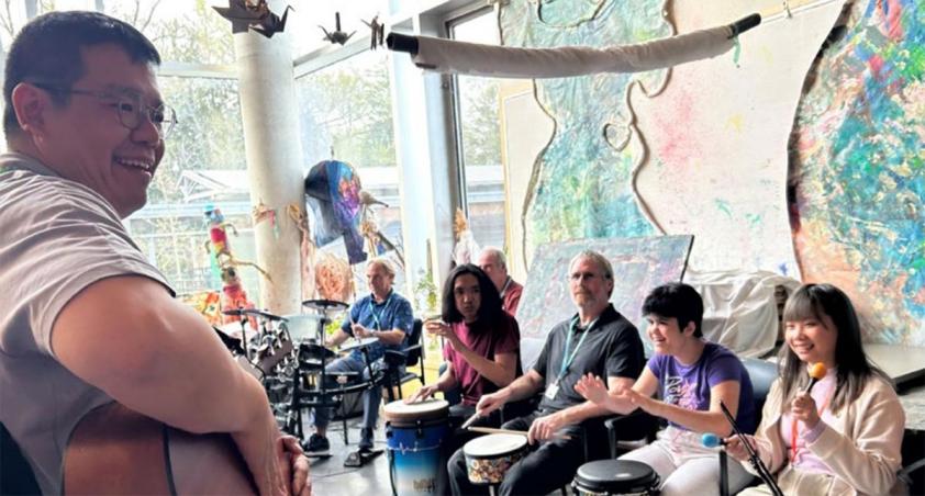 Some people playing music in an indoor setting