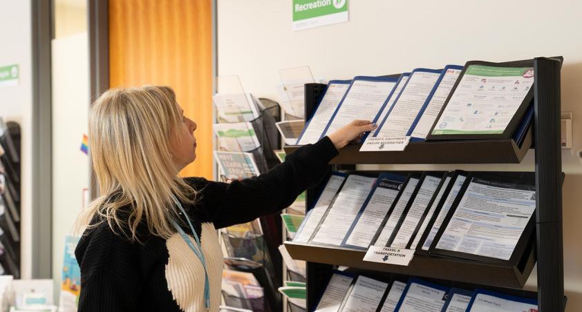 A person is trying to get some resources from a library