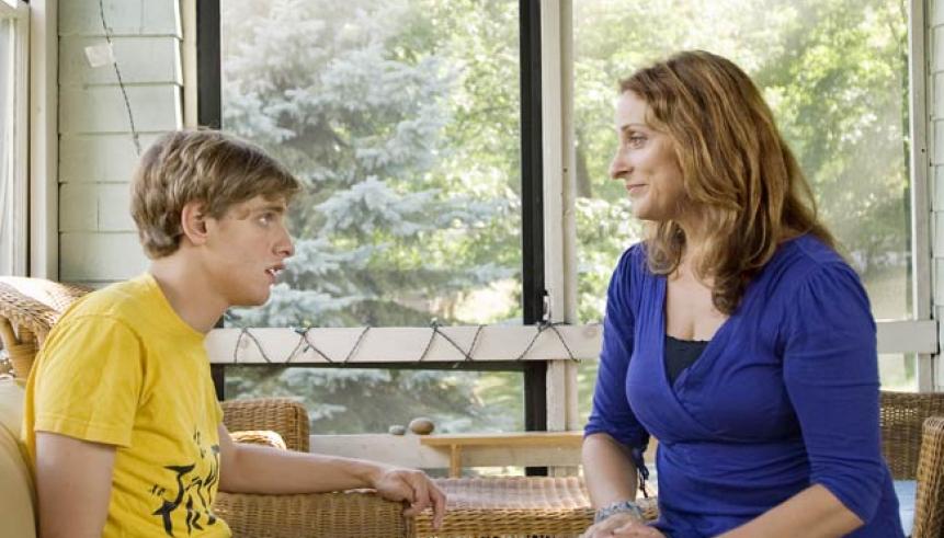 A mother sitting with her son