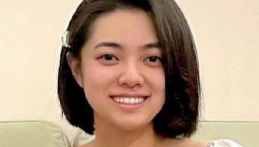 A woman with short black hair.
