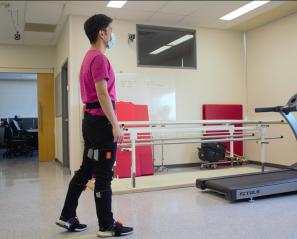 Calvin Ngan, a trainee at the Bloorview Research Institute's PROPEL Lab, demonstrates bio-feedback technology in gait training