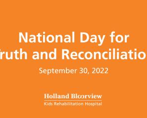 Orange sign reading "National Day for Truth and Reconciliation, September 30, 2022" in white text