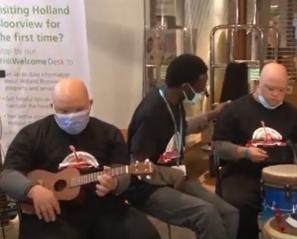 Several clients playing instruments in Holland Bloorview's Coriat Atrium
