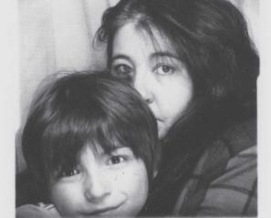 Image of faces of woman with long dark hair and boy with dark hair
