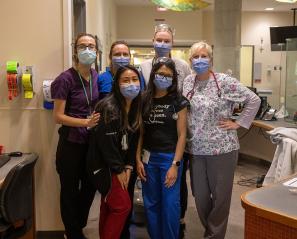 Some hospital staffs having a group photo in a hospital setting