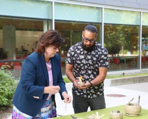 Deborah Richardson, Ontario’s Deputy Minister of Health and Conrad Prince, lead of Indigenous health strategy, Toronto Academic Health Science Network, preparing the smudging ceremony during the opening event.