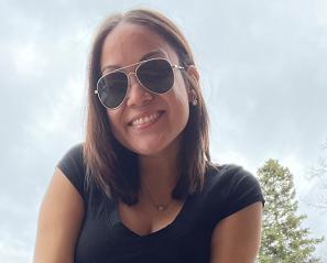 Close-up of Dennisse outside, smiling