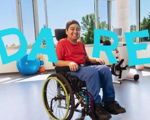 A teenager on a wheelchair, with the word "DARE"