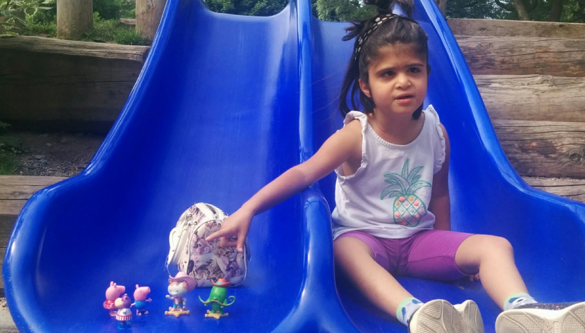 Lilly sitting on the slide