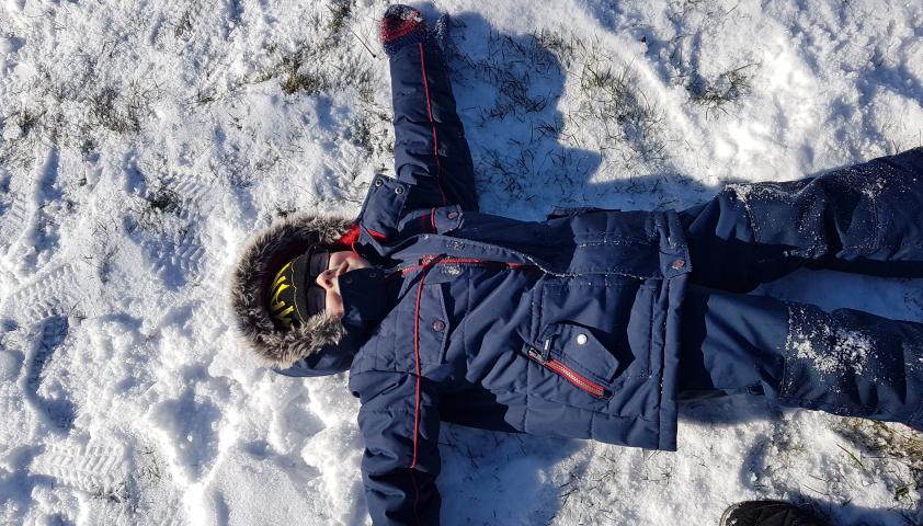 Alex making snow angels