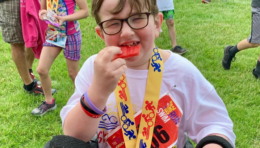 Wesley with his triathlon medal. 