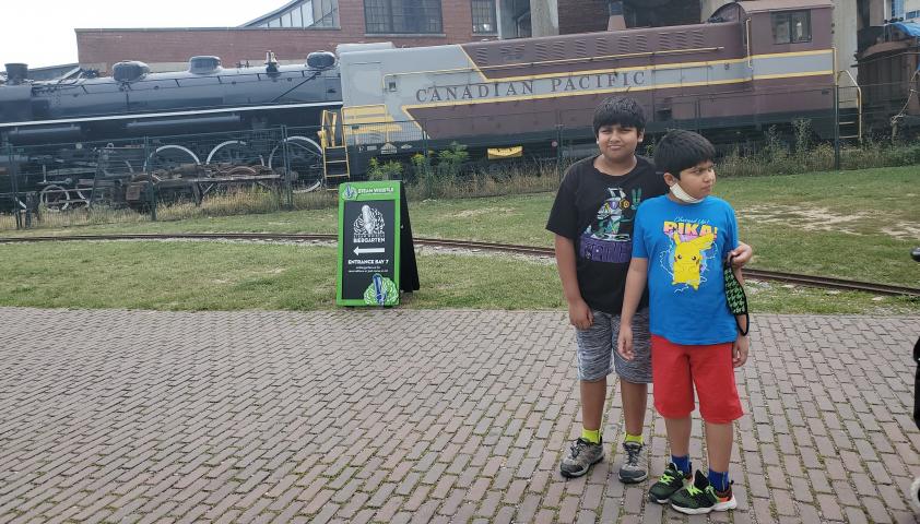 Mahad and Zain looking at trains.