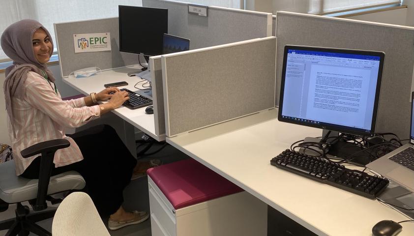 Zehra at desk.