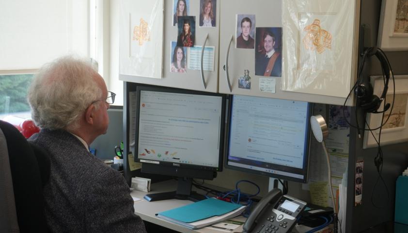 Dr. Peter Rumney working in his office