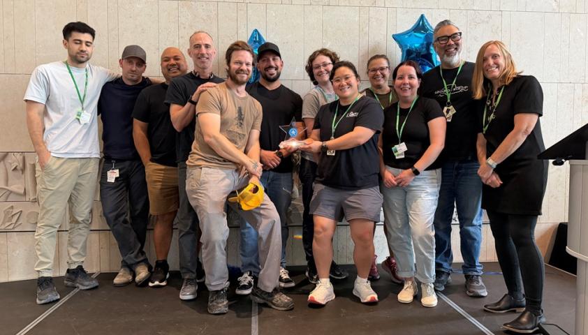 group of people standing for a photo in atrium
