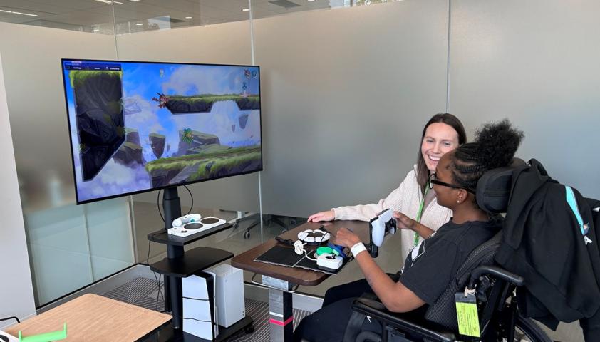 client plays video games with clinician by her side