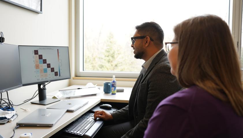 clinicians looking at graph on a computer screen