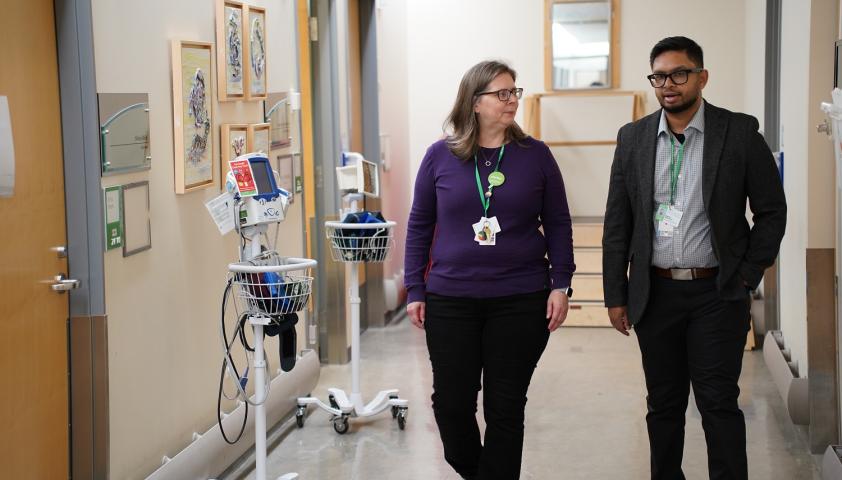 clinicians walking down a hallway