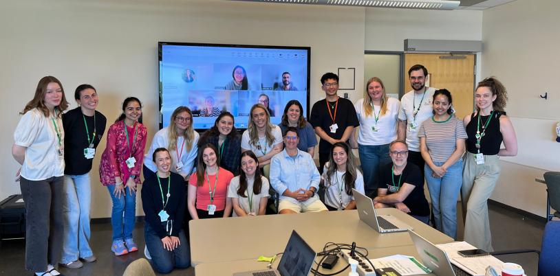 group of clinicians in a room smiling