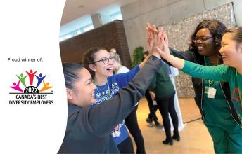 Image of staff and student high-fiving with Canada's Best Diversity Employer 2022 logo on left side of image