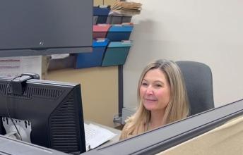 Sharon Ouellette at her desk