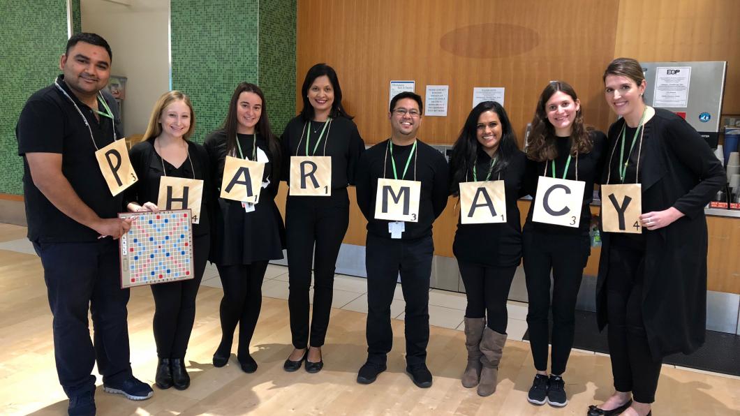 The pharmacy team in a Scrabble costume. 