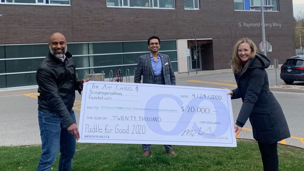 Muraly and Kundan at the donation cheque presentation.