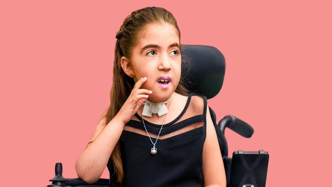 Young girl in wheelchair against pink background with text reading "Questions about the children's vaccine?"