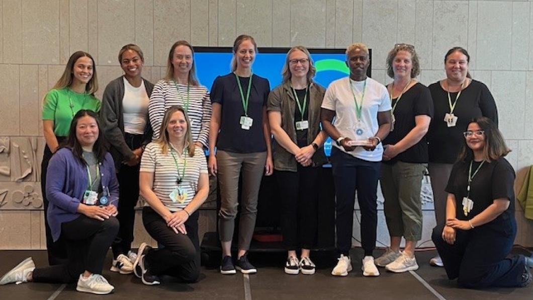 Group photo of some people standing on a stage