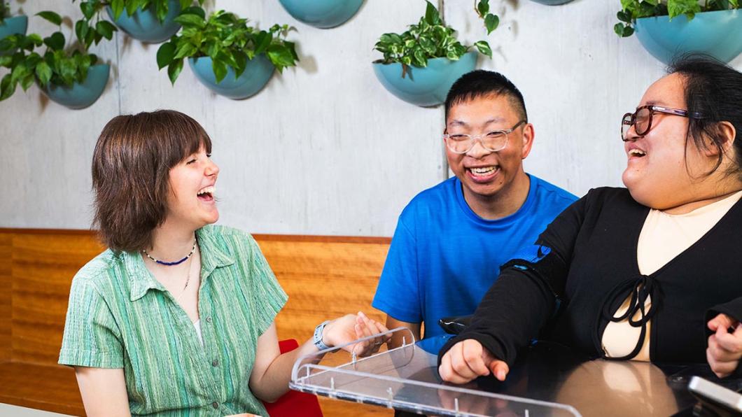 Three people chatting