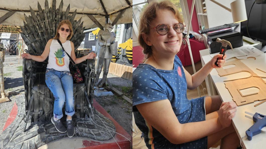 Woman sitting in ancient chair with spikes and at a drawing board holding a hammer