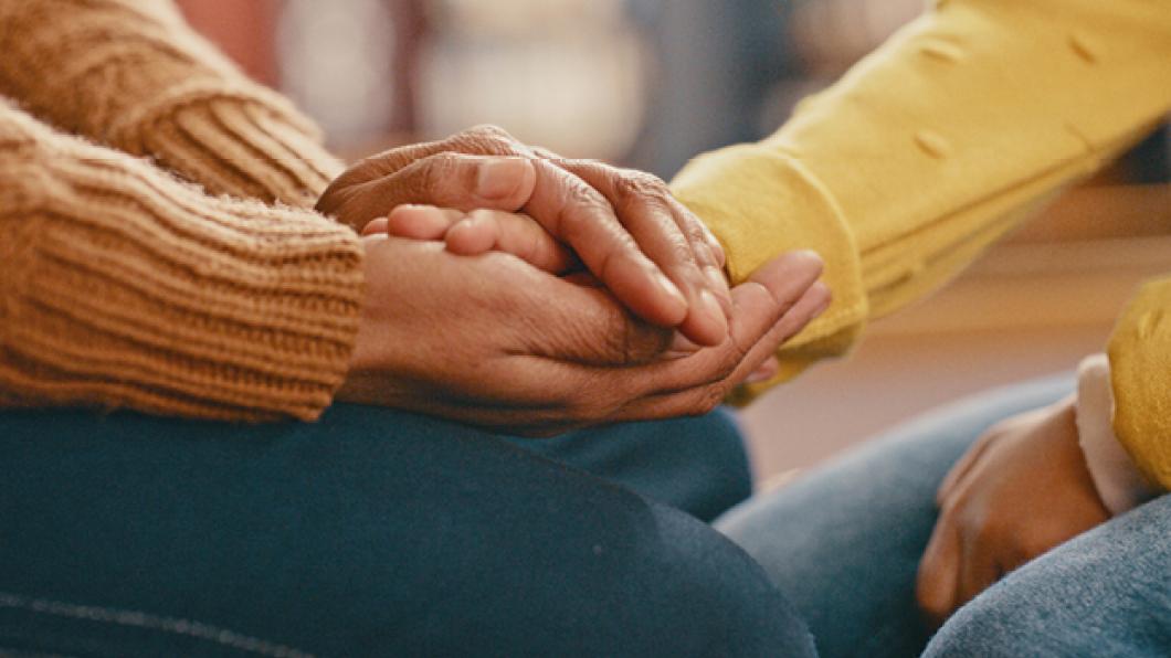 Some hands holding each other