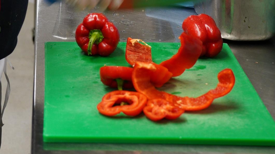 Chef is preparing some food in a kitchen