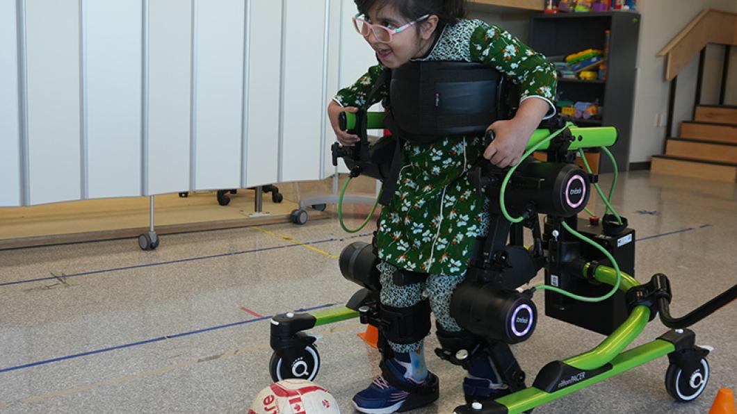 A child using the Trexo to move around a room