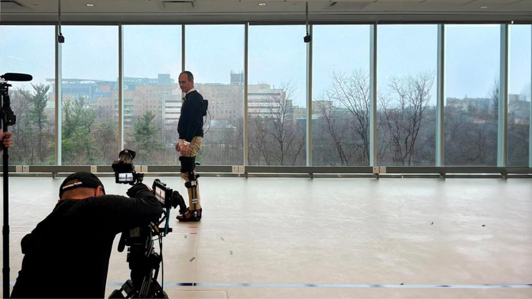 A person wearing some detection devices and a camera is filming towards that person